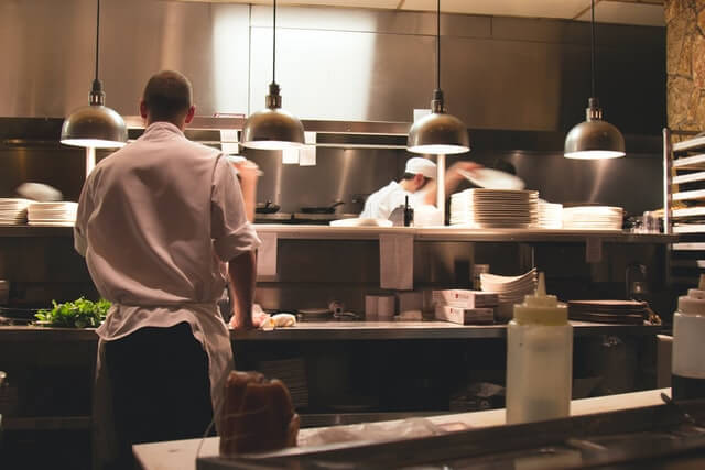 chef standing in restaurant kitchen